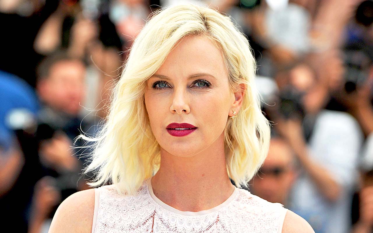 cine este dating charlize tharron